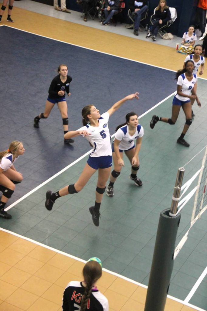 Melani goes in for the kill for her club team.